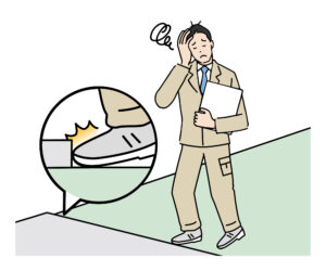 段差でつまずいている人