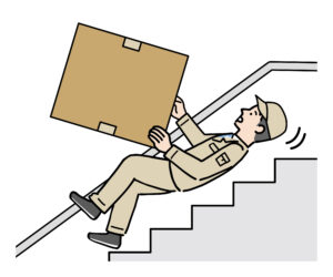 荷物を持って階段で転ぶ人