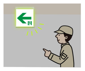 誘導灯設置場所を確認する人