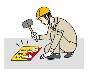 路面標示ノンスリップシートを施工している様子